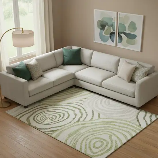 Green Gray And Ivory Abstract Washable Area Rug With UV Protection Photo 1