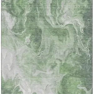 Photo of Green Gray And Ivory Abstract Washable Area Rug With UV Protection