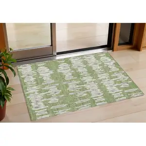 Photo of Green Gray And Ivory Striped Washable Indoor Outdoor Area Rug