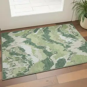Photo of Green Ivory And Beige Abstract Washable Area Rug With UV Protection