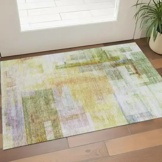Green Ivory Gold And Purple Abstract Geometric Washable Area Rug With UV Protection Photo 1