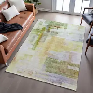 Photo of Green Ivory Gold And Purple Abstract Geometric Washable Area Rug With UV Protection