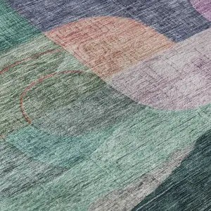 Photo of Green Orange Purple And Teal Abstract Geometric Washable Area Rug With UV Protection
