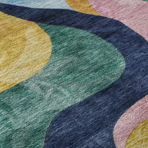 Photo of Green Orange Teal And Pink Abstract Washable Area Rug With UV Protection