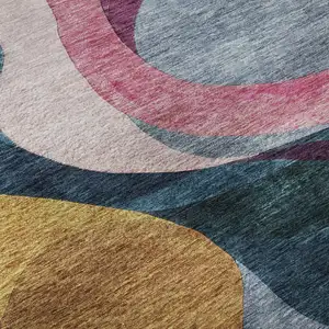 Photo of Green Pink Purple And Teal Abstract Washable Area Rug With UV Protection