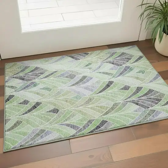 Green Purple And Ivory Geometric Washable Area Rug With UV Protection Photo 1