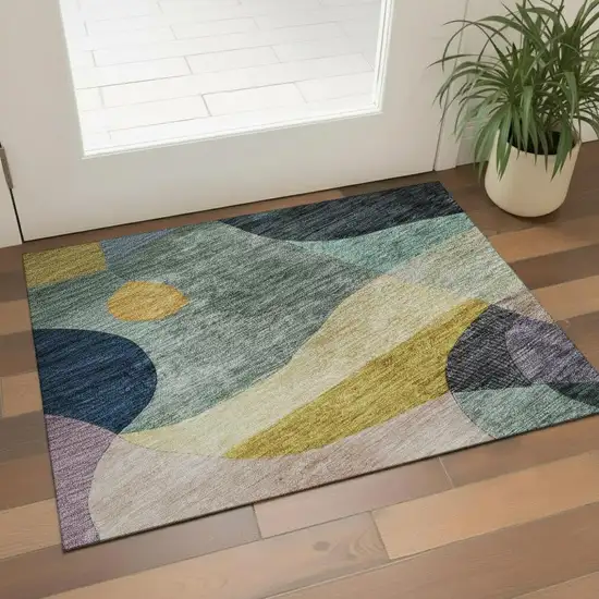 Green Purple Gold And Teal Abstract Geometric Washable Area Rug With UV Protection Photo 2
