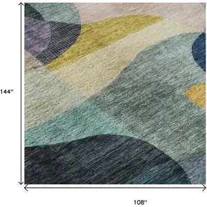 Photo of Green Purple Gold And Teal Abstract Geometric Washable Area Rug With UV Protection