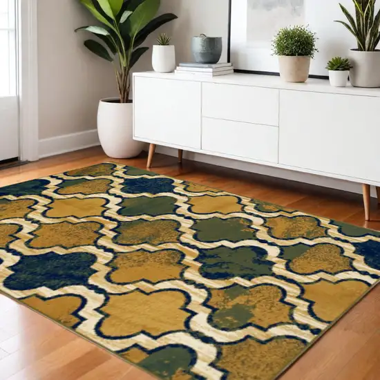 Green Brown And Ivory Quatrefoil Distressed Area Rug Photo 1