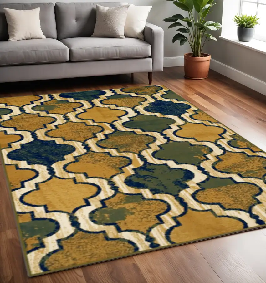 Green Brown And Ivory Quatrefoil Distressed Area Rug Photo 1