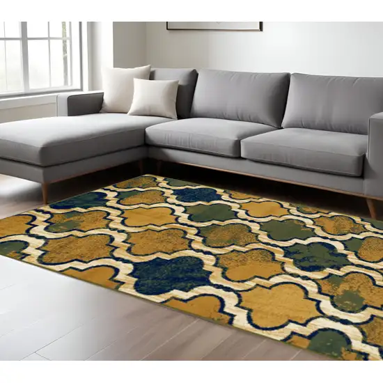 Green Brown And Ivory Quatrefoil Distressed Area Rug Photo 1