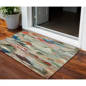 Photo of Green Teal Blue And Terra Cotta Abstract Washable Indoor Outdoor Area Rug