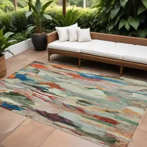 Photo of Green Teal Blue And Terra Cotta Abstract Washable Indoor Outdoor Area Rug