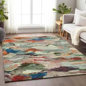 Photo of Green Teal Blue And Terra Cotta Abstract Washable Indoor Outdoor Area Rug