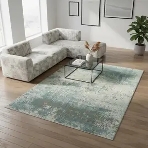 Photo of Green White And Gray Abstract Washable Area Rug With UV Protection