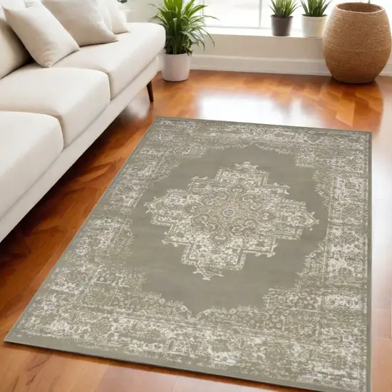 Green and Ivory Medallion Power Loom Distressed Area Rug Photo 1