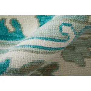 Photo of Green and Ivory Wool Floral Hand Knotted Area Rug With Fringe