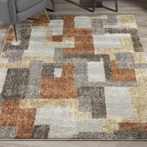 Photo of Grey And Brown Geometric Area Rug