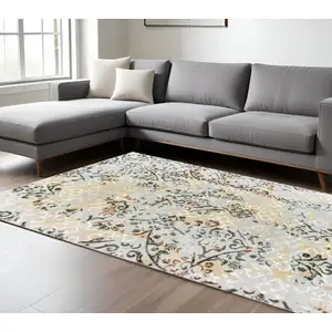 Photo of Grey And Gold Abstract Power Loom Stain Resistant Area Rug