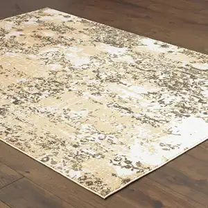 Photo of Grey And Gold Abstract Power Loom Stain Resistant Area Rug
