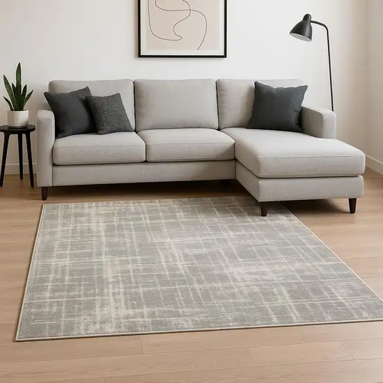 6' X 9' Grey And Ivory Abstract Shag Power Loom Stain Resistant Area Rug Photo 1