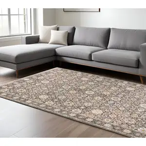 Photo of Grey And Ivory Oriental Power Loom Stain Resistant Area Rug With Fringe
