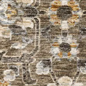 Photo of Grey And Tan Floral Power Loom Stain Resistant Area Rug With Fringe