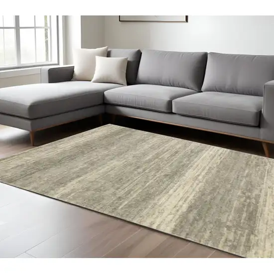 6' X 9' Grey Beige And Tan Abstract Power Loom Stain Resistant Area Rug Photo 1