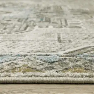 Photo of Grey Blue Beige And Gold Oriental Power Loom Stain Resistant Area Rug