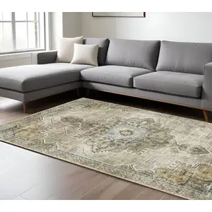 Photo of Grey Blue Beige And Gold Oriental Power Loom Stain Resistant Area Rug