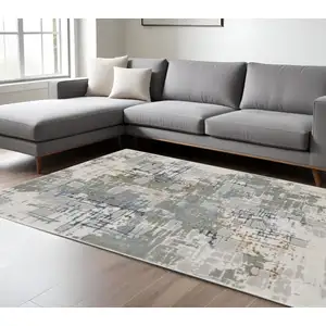 Photo of Grey Blue Brown Ivory And Deep Blue Abstract Power Loom Stain Resistant Area Rug