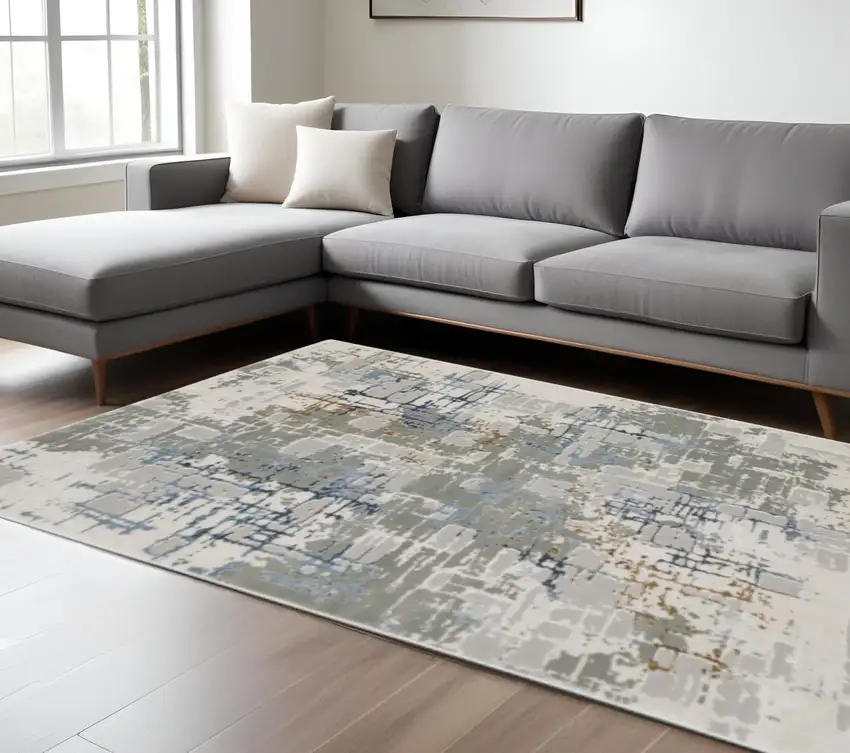6' X 9' Grey Blue Brown Ivory And Deep Blue Abstract Power Loom Stain Resistant Area Rug Photo 1