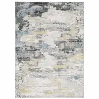 Photo of Grey Blue Charcoal Ivory Yellow Beige And Tan Abstract Printed Stain Resistant Non Skid Area Rug