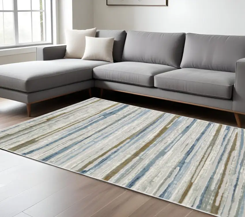 6' X 9' Grey Blue Ivory Brown Beige And Navy Abstract Power Loom Stain Resistant Area Rug Photo 1