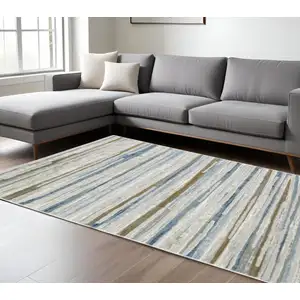 Photo of Grey Blue Ivory Brown Beige And Navy Abstract Power Loom Stain Resistant Area Rug