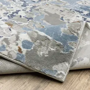 Photo of Grey Blue Ivory Navy Beige And Brown Abstract Power Loom Stain Resistant Area Rug