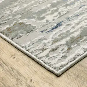 Photo of Grey Blue Light Blue Ivory And Brown Abstract Power Loom Stain Resistant Runner Rug