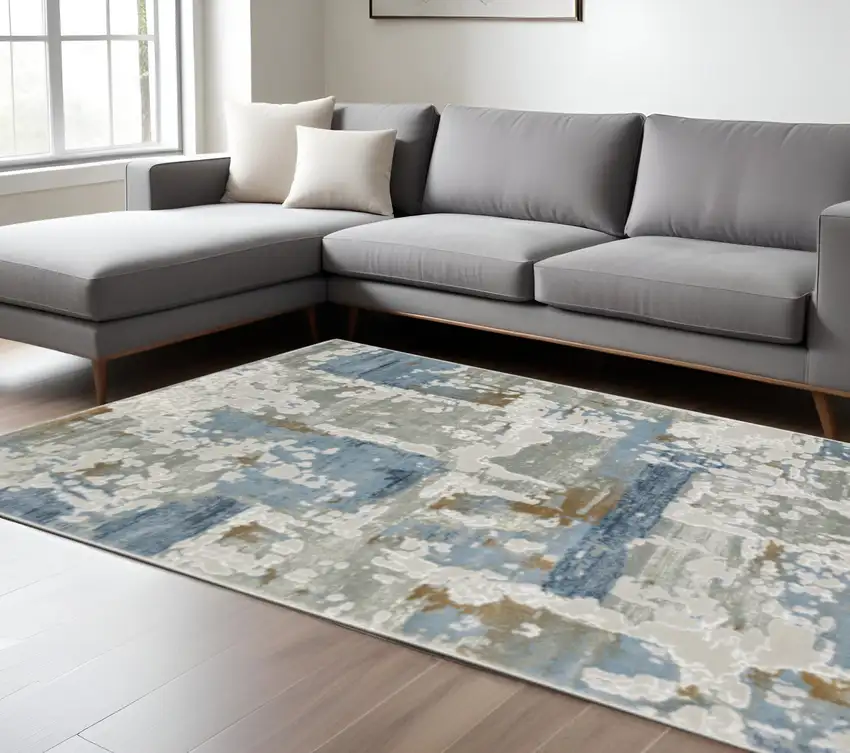 6' X 9' Grey Blue Navy Ivory And Brown Abstract Power Loom Stain Resistant Area Rug Photo 1