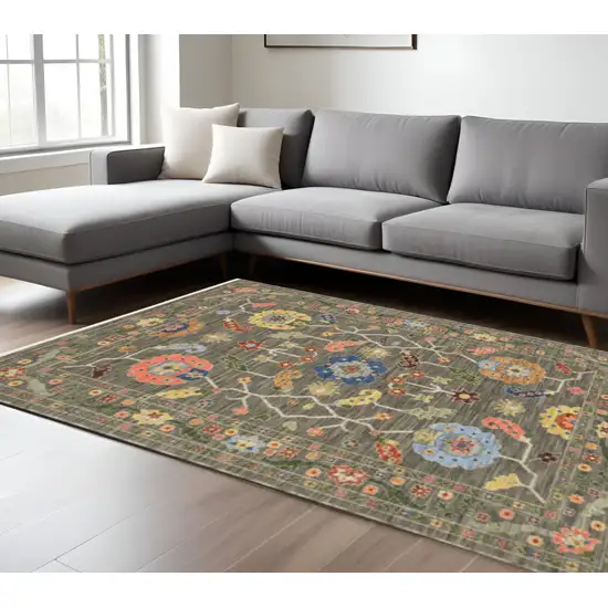 6' X 9' Grey Blue Pink Orange Rust Red Green And Ivory Oriental Power Loom Stain Resistant Area Rug With Fringe Photo 1