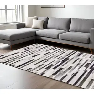Photo of Grey Charcoal And Beige Geometric Power Loom Stain Resistant Area Rug
