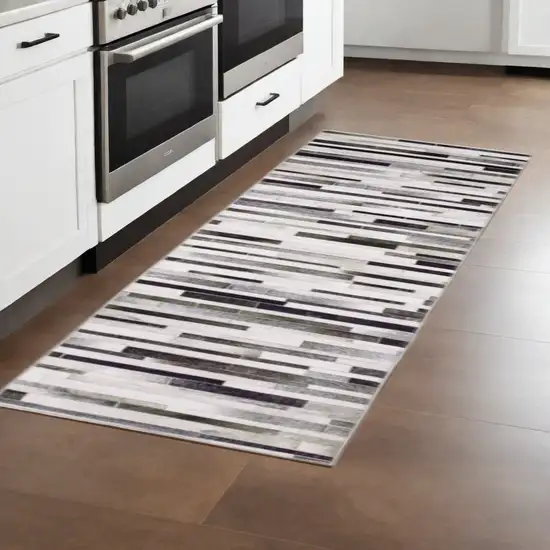 8' Gray Brown and Ivory Geometric Power Loom Runner Rug Photo 1
