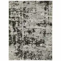 Photo of Grey Charcoal Black And Ivory Abstract Power Loom Stain Resistant Area Rug