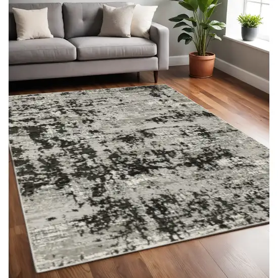 Grey Charcoal Black And Ivory Abstract Power Loom Stain Resistant Area Rug Photo 1