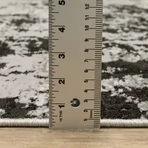 Photo of Grey Charcoal Black And Ivory Abstract Power Loom Stain Resistant Area Rug