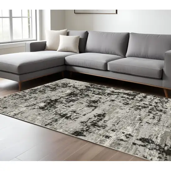 Grey Charcoal Black And Ivory Abstract Power Loom Stain Resistant Area Rug Photo 1
