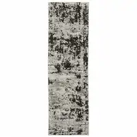 Photo of Grey Charcoal Black And Ivory Abstract Power Loom Stain Resistant Runner Rug