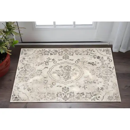 Gray And Tan Floral Distressed Area Rug Photo 1