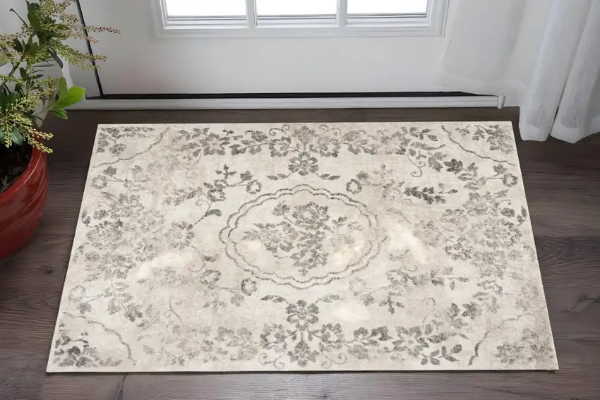 Gray And Tan Floral Distressed Area Rug Photo 1