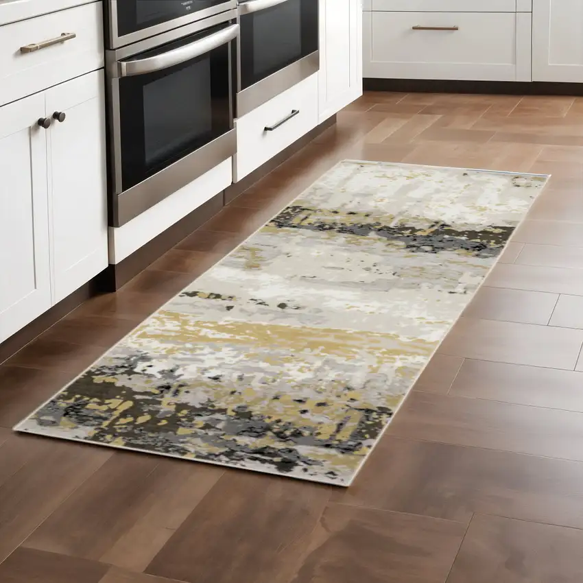2' X 8' Grey Gold Beige Black And Brown Abstract Power Loom Stain Resistant Runner Rug Photo 1