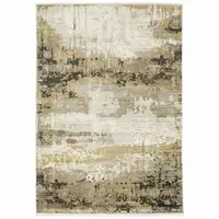 Photo of Grey Gold Black Charcoal And Beige Abstract Power Loom Stain Resistant Area Rug With Fringe